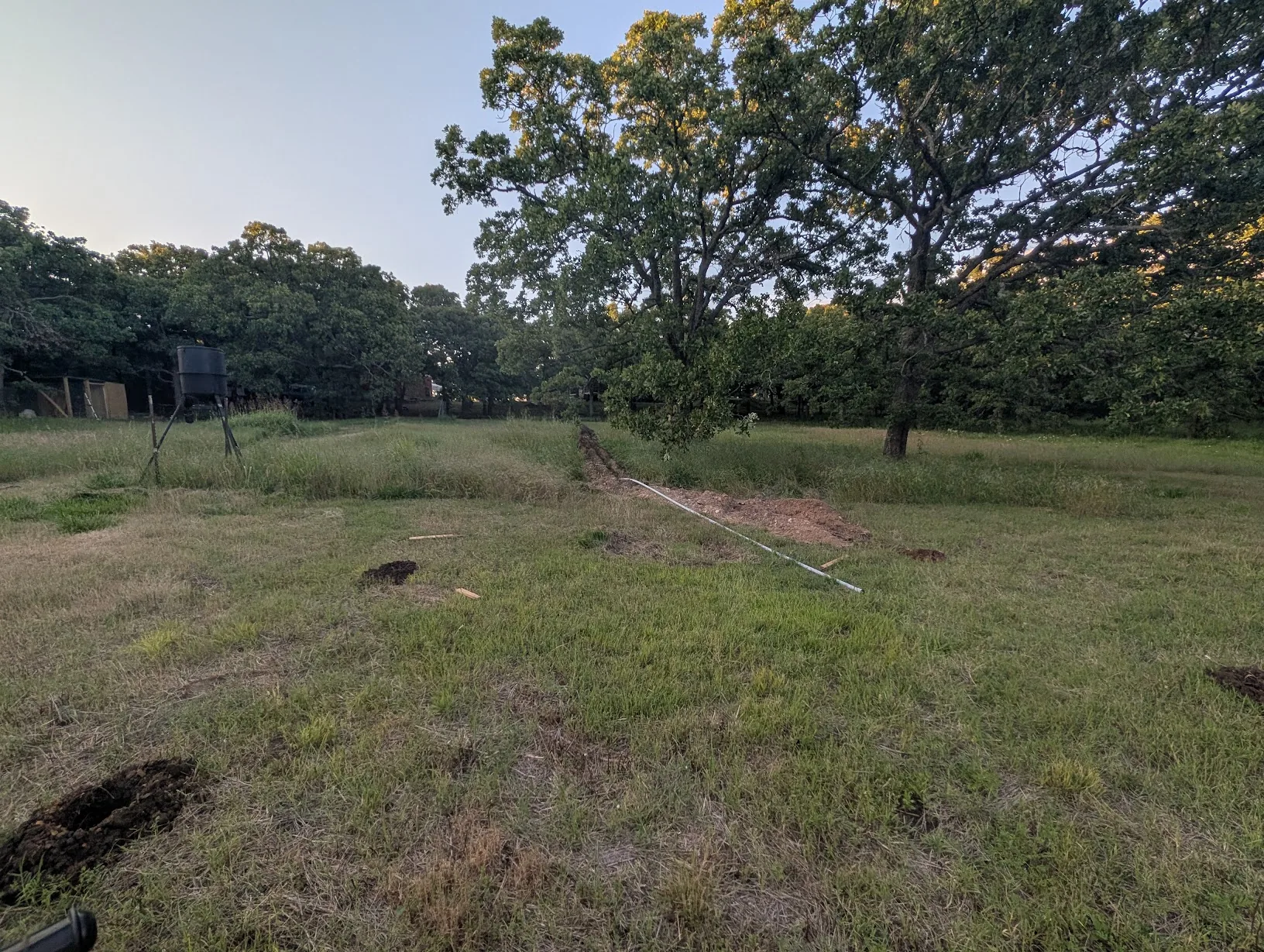 300ft of 1\" conduit run with the end capped, four post holes visible