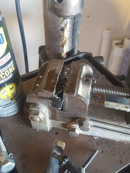 Bar stock with mounting holes drilled.