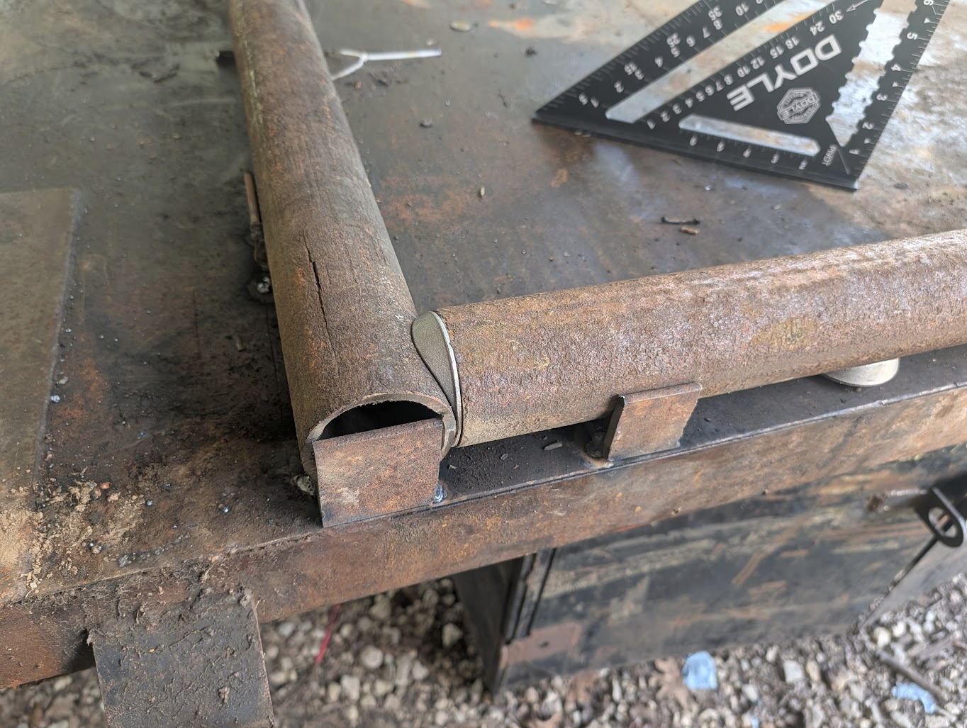 Split section of drill string next to a fitted saddle cap