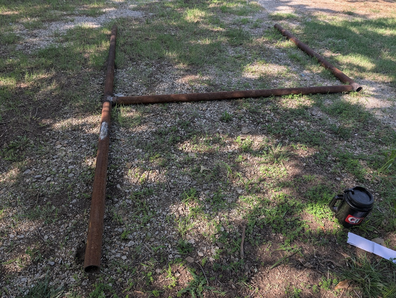 First completed frame — rear legs, front leg, and cross-bar welded up