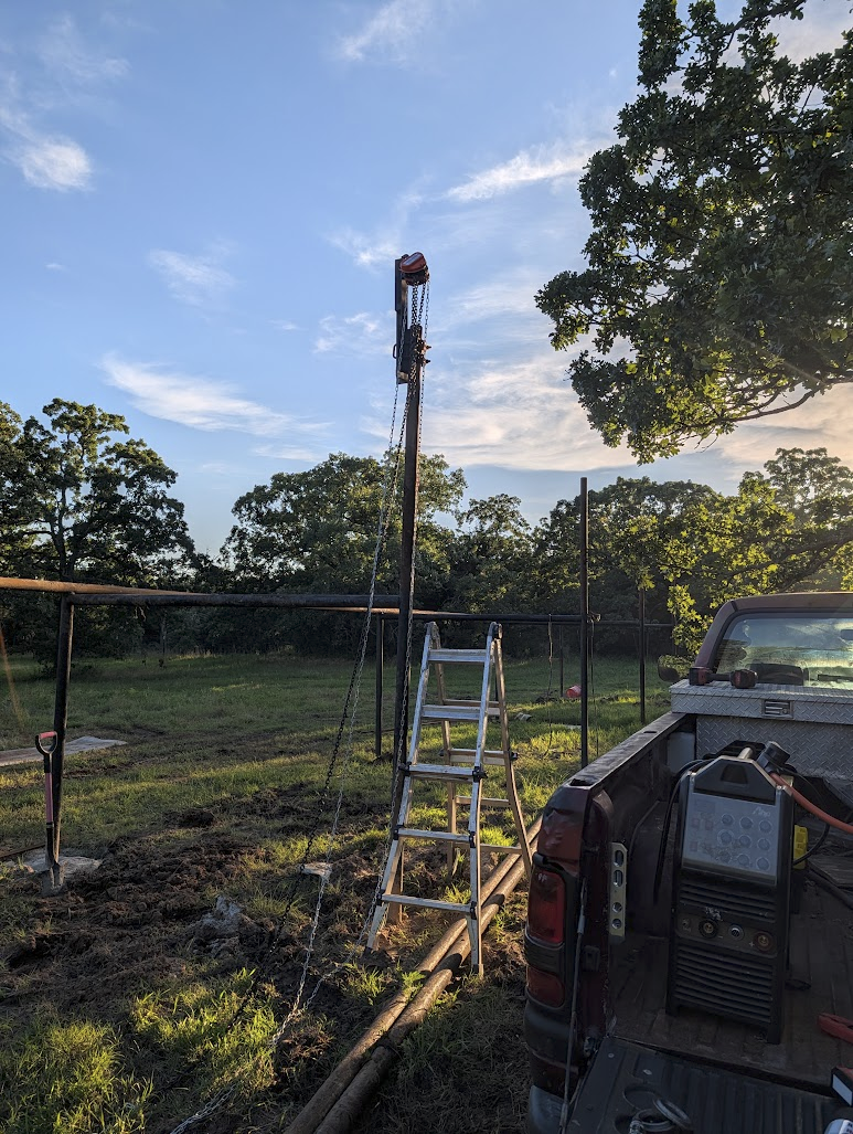 Lifting jig clamped to the top of a post