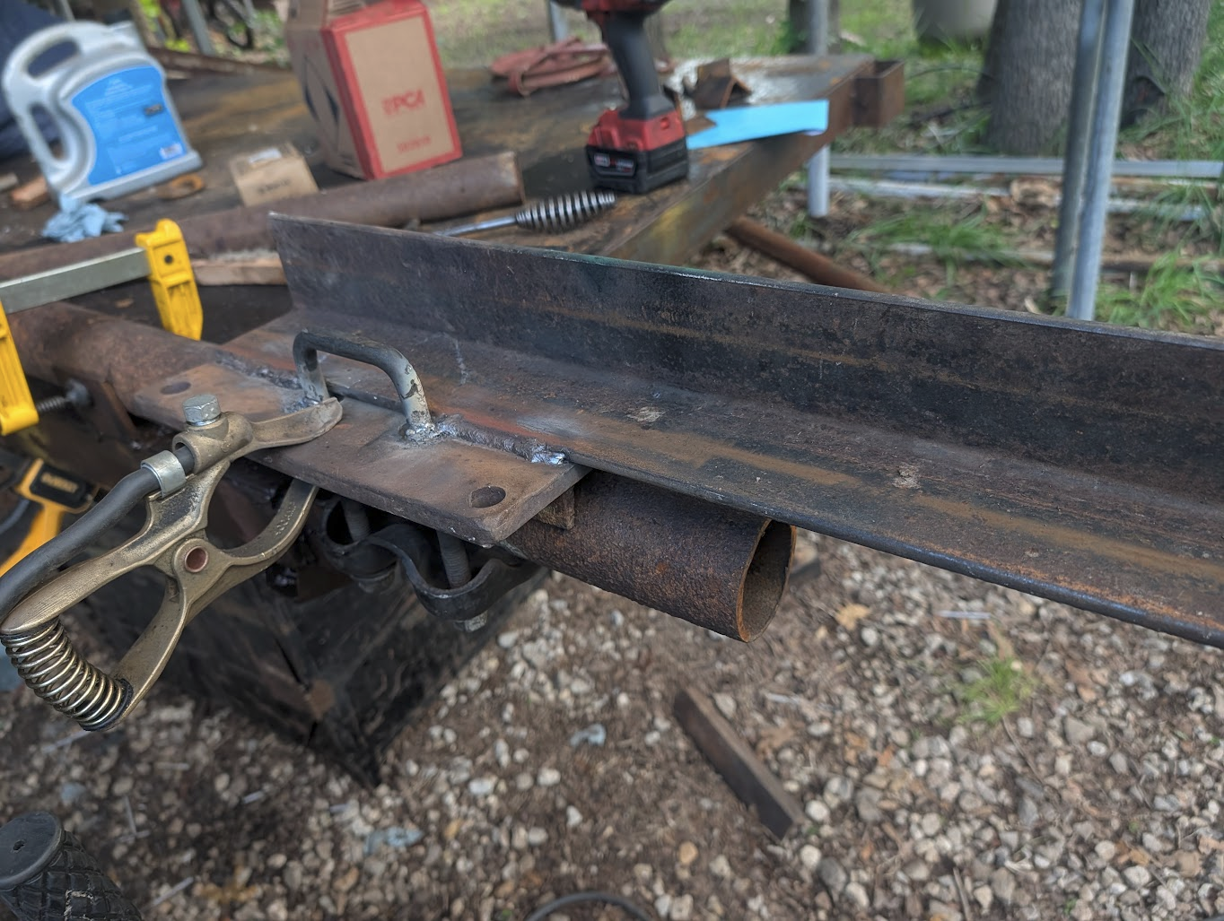 Leaf-spring shackle and a length of angle iron, before welding