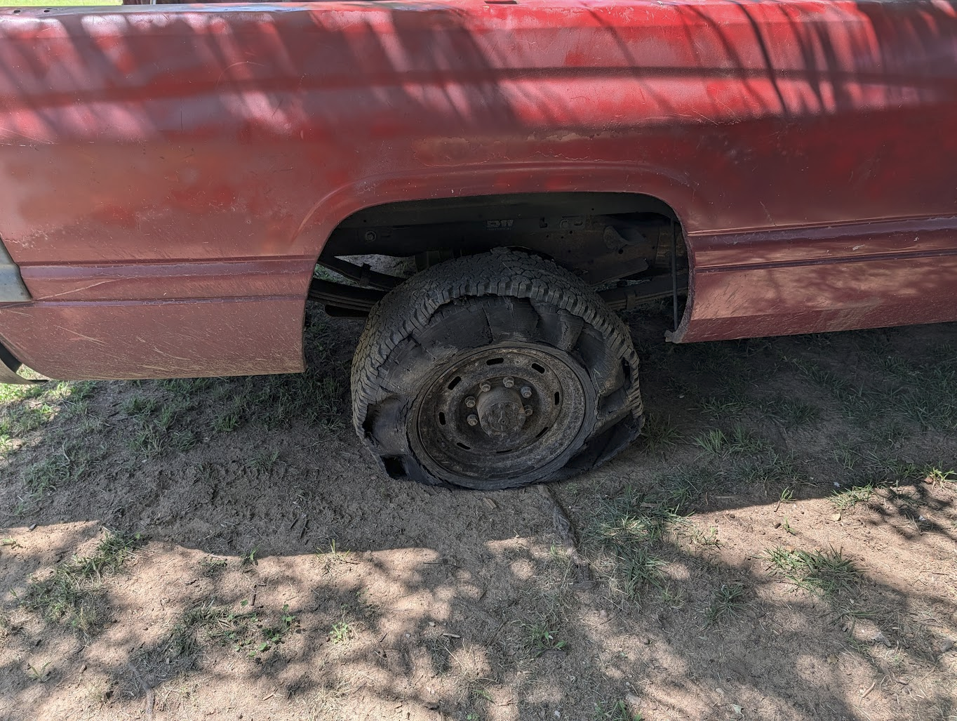 Spare tire showing heavy wear and cracking