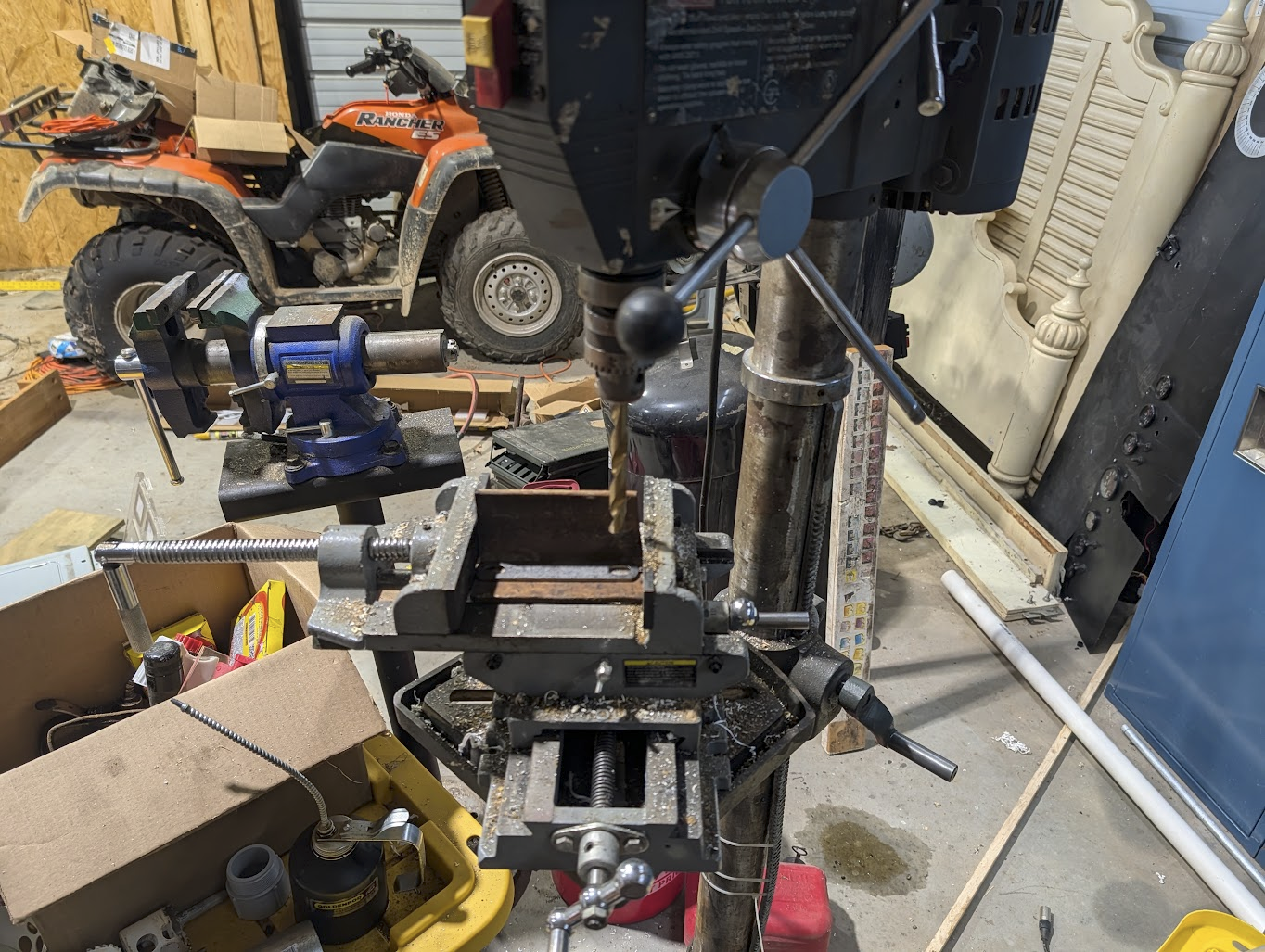 Drilling mounting holes through the angle iron brackets