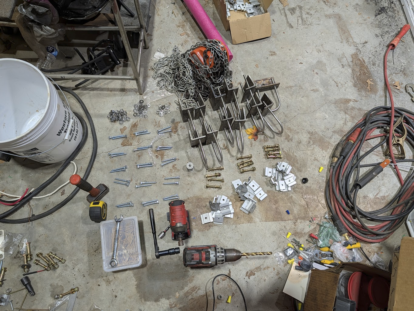 Tools and hardware laid out for installing one three-column section