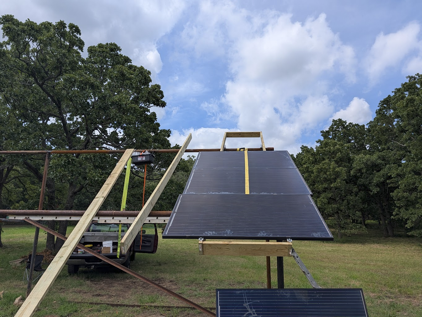 Ratchet straps pulling a panel into position on the rack